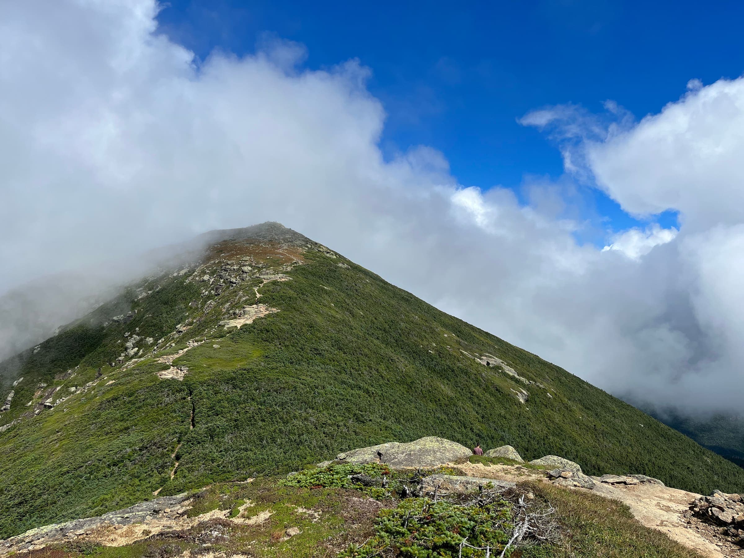 Mountain peak with clouds rolling through